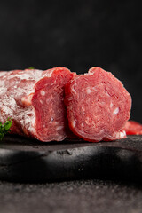 Dry sausage slice pork less fat jamon cured meat natural product tasty snack fresh delicious gourmet food background on the table rustic top view copy space