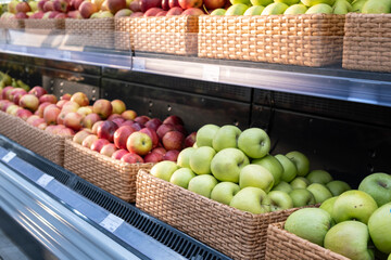Boxes of apples in a supermarket, fruit sales.