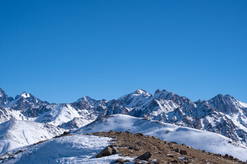 Winter landscape in the Trans-Ili Alatau mountains near Almaty. Winter, snow in the mountains. Hiking trails in the mountains near Almaty.