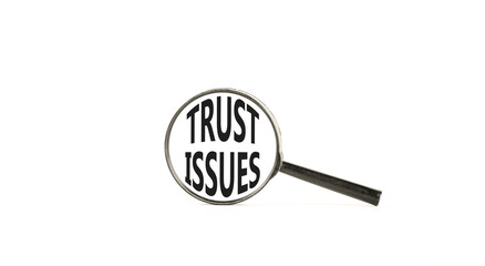 Trust issues symbol. Concept word Trust issues on beautiful magnifying glass. Beautiful white paper...