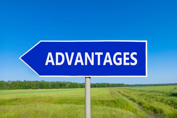 Advantages symbol. Concept word Advantages on beautiful blue road sign. Beautiful blue sky green grass and forest peaceful nature background. Business advantages concept. Copy space.