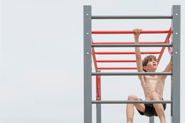 A little boy is engaged in gymnastics equipment