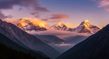 Majestic snow-capped mountains illuminated by golden sunrise light, with dramatic clouds and misty valleys below, creating a breathtaking natural landscape vista.