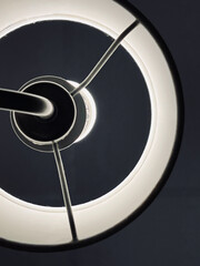 Abstract minimalist lamp light creating circular glow.