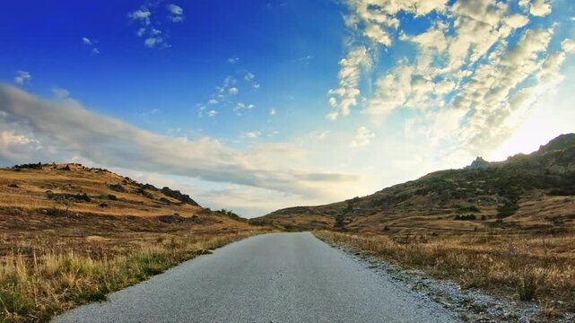 Enjoyable ride, beautiful hilly nature, dry vegetation, POV driver perspective
