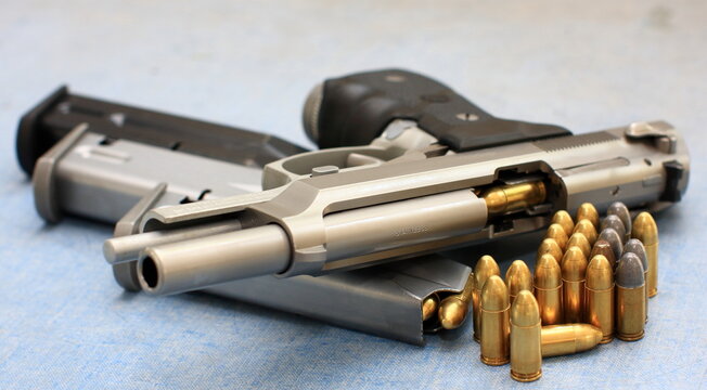 bullet 9mm parabellum and Beretta 92FS, M9 gun barrel.