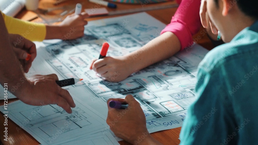 Poster top view of civil engineer team writing at blueprint at meeting table with color palettes. group of 
