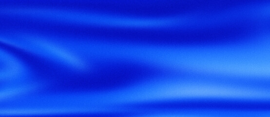 Abstract blue silk fabric background with soft folds and subtle light effects