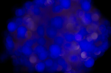 Blue glow. Abstract background. Light and bokeh. Abstraction circles on a black background.