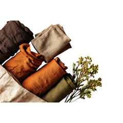 Warm earthy textiles and natural greenery artfully arranged for a cozy, sophisticated aesthetic, evoking comfort and organic beauty.