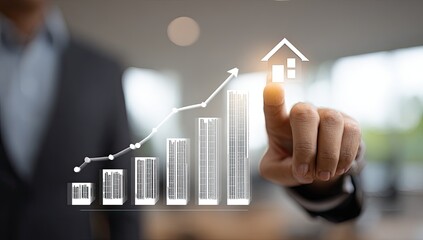 Business person's finger touches a projected graph of rising real estate values