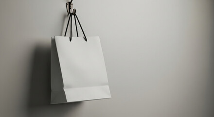 Stylish shopping bag mockup hanging on hook with neutral background, ideal for branding, packaging design, retail identity, advertising display, and creative product presentation