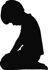 Silhouette of a child kneeling with head bowed in quiet reflection