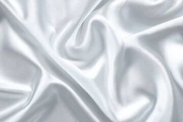 Obraz premium Smooth, flowing white fabric drapes in folds and curves