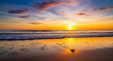 Beautiful Orange Sunset Over a Sandy Beach With Gentle Waves Breaking On Shore