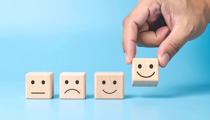 Hand placing a happy face wooden block (1)