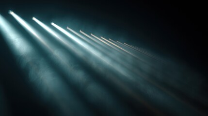 Bright beams of light shine through a thick layer of smoke creating a striking visual effect in a dark environment. The contrast highlights the intensity of the scene.