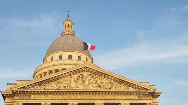The panthon in paris stands majestically against a clear blue sky