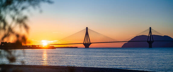 View of the bridge Rio-Antirio, Charilaos Trikoupis in Greece, at sunset.
