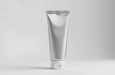 Silver metallic plastic cosmetic tube for cosmetic product, isolated on white or gray background