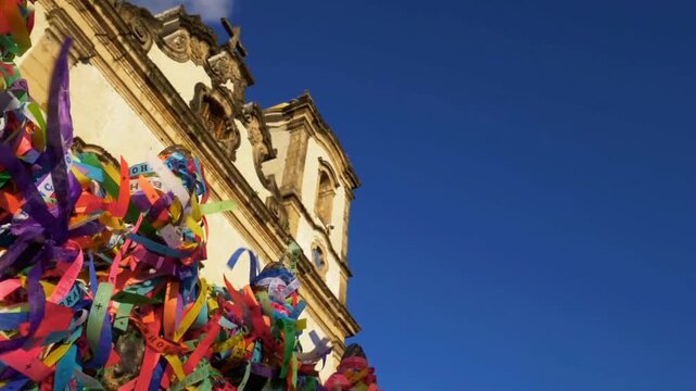 Colorful ribbons adorn the facade of the igreja do senhor do bonfim in salvador