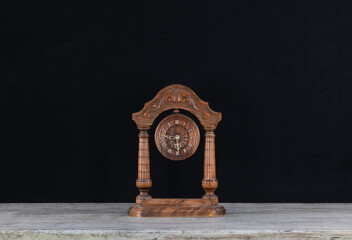decorative wooden clock on the table