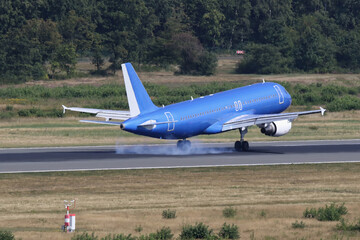 airplane landing on a runway
