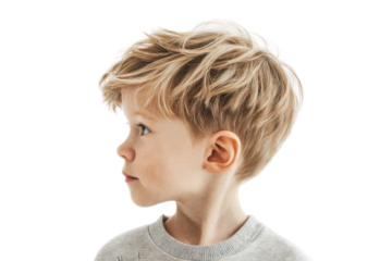Profile of young caucasian male child with blonde hair looking to the side, cut out