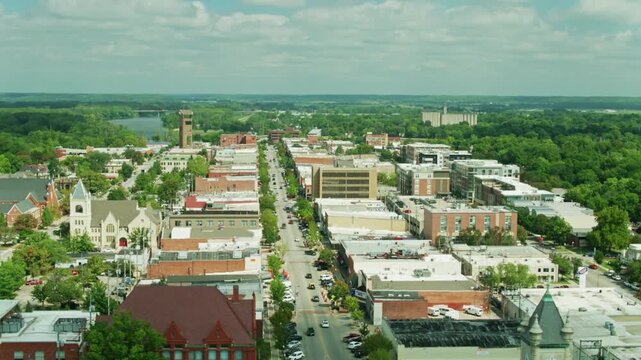 Aerial view captures downtown lawrence, kansas, with its buildings and green trees