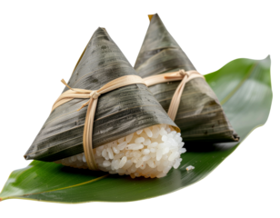 Traditional Chinese sticky rice dumplings wrapped in bamboo leaves zongzi isolated png transparent background
