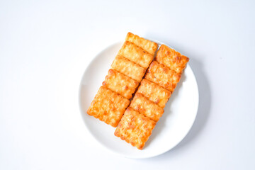Square biscuits coconut over a white background.