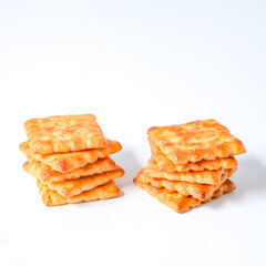 Square biscuits coconut over a white background.