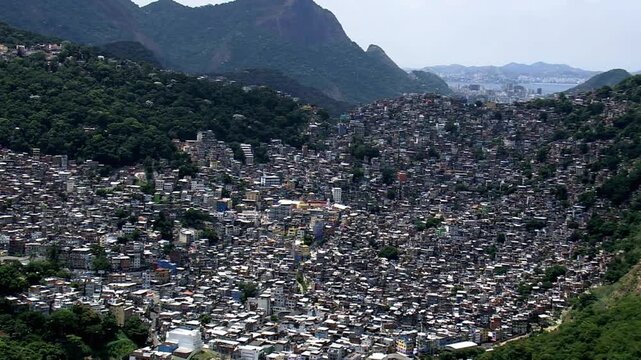 A sprawling favela clings to the hillsides of rio de janeiro, brazil