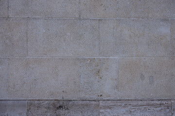 Plain beige stone wall texture with horizontal lines
