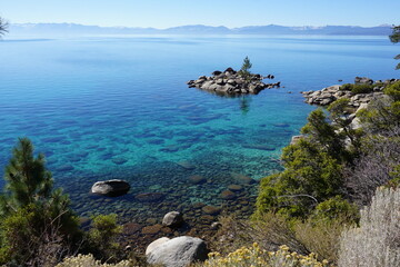 panoramic view of clear water, rocks and sand in beautiful lake Tahoe, Ca, USA, on a sunny day near Sand harbor