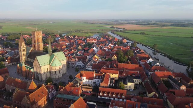 Aerial view of Ribe Cathedral rising above red rooftops in Denmark&rsquo;s oldest town &mdash; historic architecture meets scenic urban charm