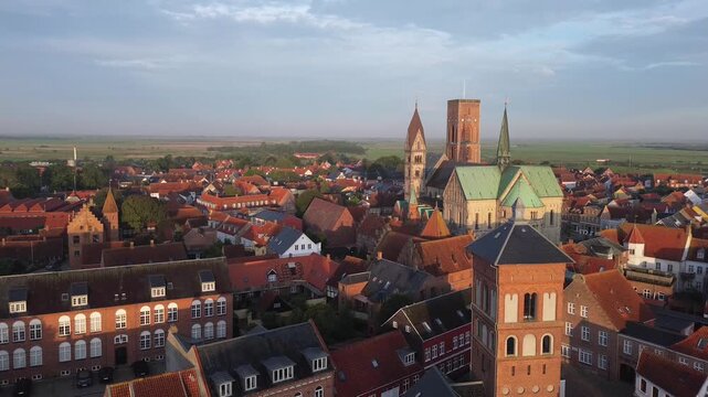 Aerial view of Ribe Cathedral rising above red rooftops in Denmark&rsquo;s oldest town &mdash; historic architecture meets scenic urban charm