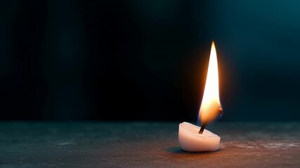 Delicate white candle emitting soft radiant flame against deep teal backdrop. Intimate macro loop reveals intricate flame details on textured surface. - Powered by Adobe