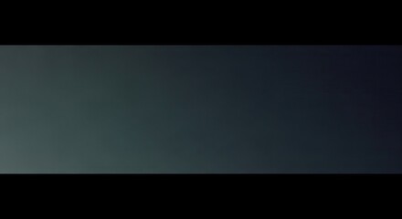 A simple gradient of gray and black tones with a subtle transition in the background area space