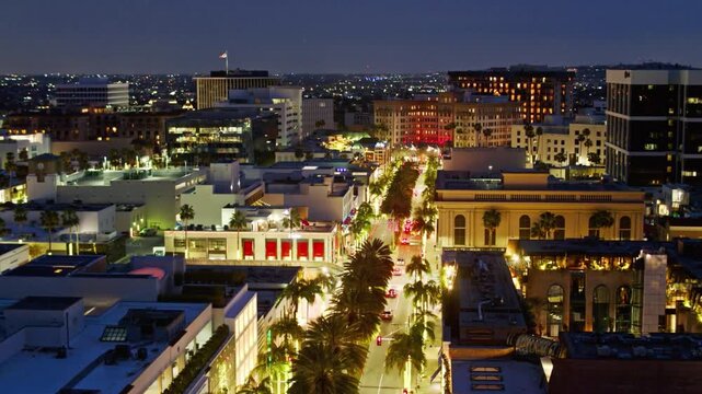 An aerial view of beverly hills at night showcases the city lights