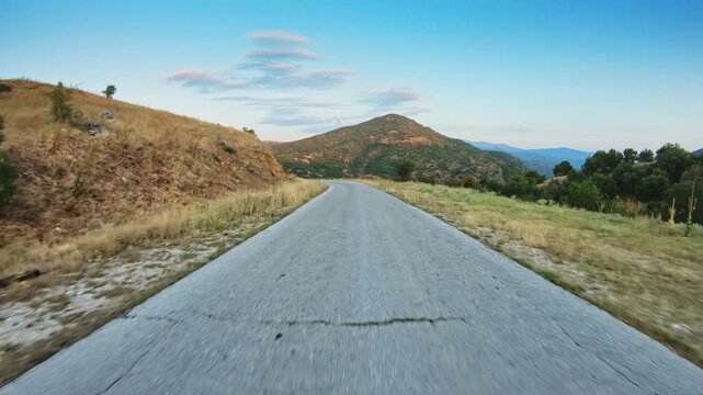 POV driver perspective, driving on narrow road in the mountain, height