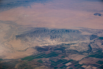 Aerial view of California Mountains, view from airplane window.
See less