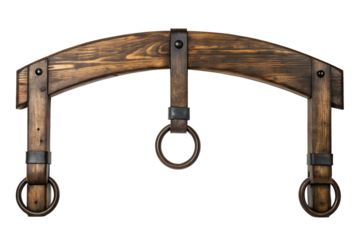 Antique wooden shoulder yoke for carrying water buckets or pails. Rustic farm equipment with metal rings isolated on a white background