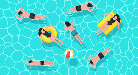 People relaxing and enjoying a sunny day floating in a bright blue swimming pool on inflatable toys and rafts with a beach ball