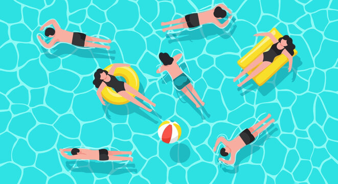 People relaxing and enjoying a sunny day floating in a bright blue swimming pool on inflatable toys and rafts with a beach ball