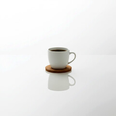 Obraz premium White coffee mug with hot espresso on a saucer, isolated on a white background