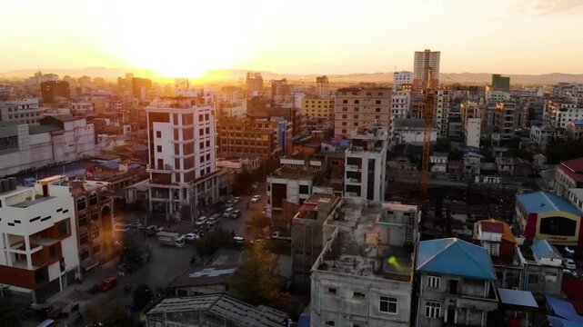 Golden sunset illuminates the cityscape of yangon, myanmar with warm light