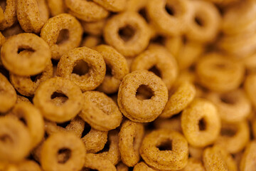 Golden toasted oat cereal rings create a delicious breakfast bowl or satisfying snack, perfect for happy kids and healthy eating campaigns or breakfast promotions