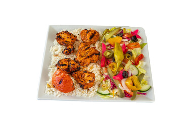 Grilled chicken kebab served with rice and fresh salad on a white square plate on transparent background