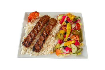 Delicious adana kebab served with rice and fresh salad on a white square plate on transparent background
